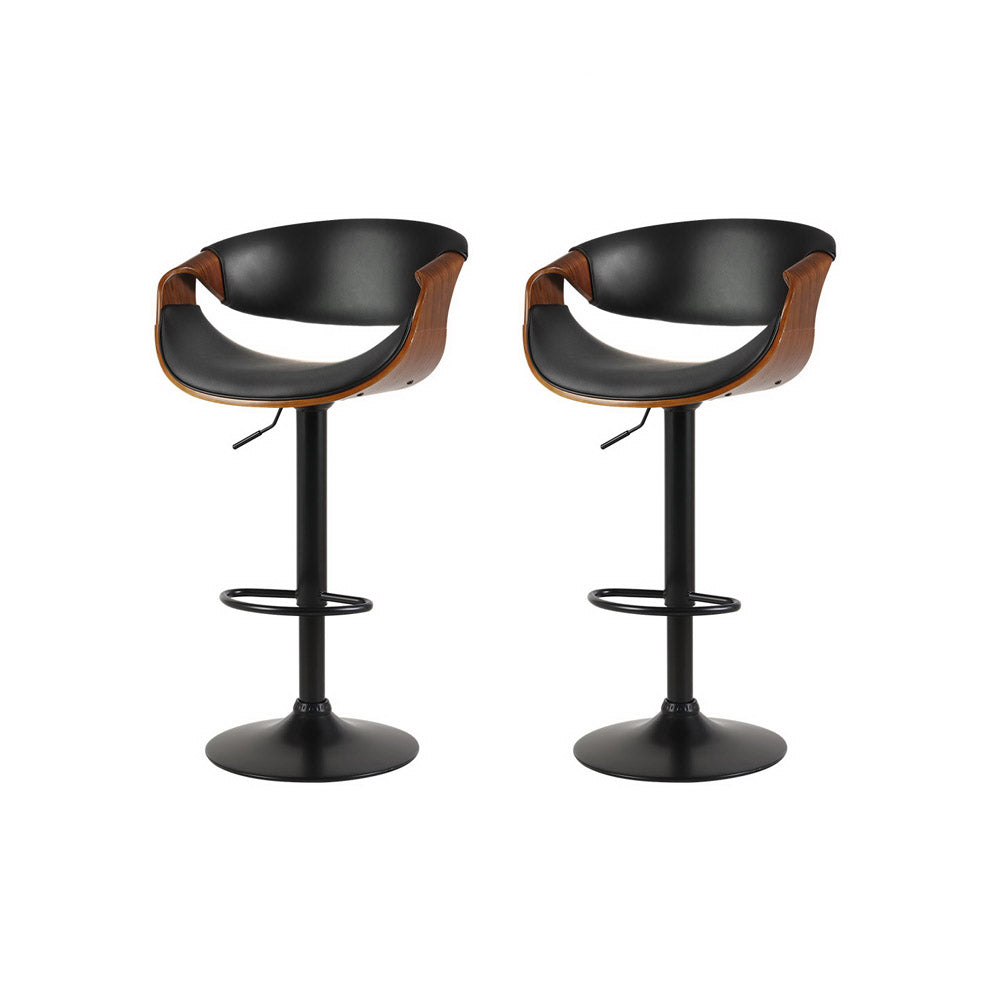 Tenby Point black gas lift swivel bar stool with curved backrest in a modern kitchen