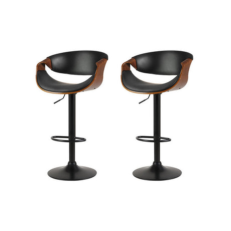 Tenby Point black gas lift swivel bar stool with curved backrest in a modern kitchen