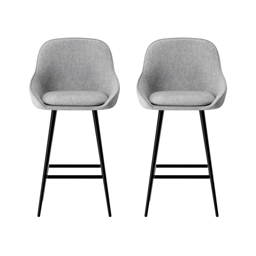 Beaumaris grey upholstered bar stool with winged backrest at a kitchen counter