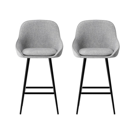 Beaumaris grey upholstered bar stool with winged backrest at a kitchen counter