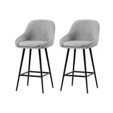 Beaumaris grey upholstered bar stool with winged backrest at a kitchen counter