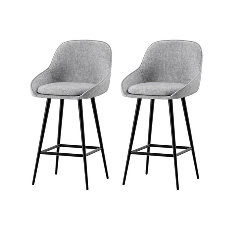 Beaumaris grey upholstered bar stool with winged backrest at a kitchen counter