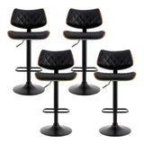 Bass black gas lift swivel bar stool with bentwood seat in a modern kitchen