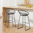 Patterson Lakes black faux linen bar stool with padded seat and steel frame at a kitchen counter
