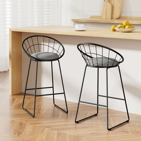 Patterson Lakes black faux linen bar stool with padded seat and steel frame at a kitchen counter
