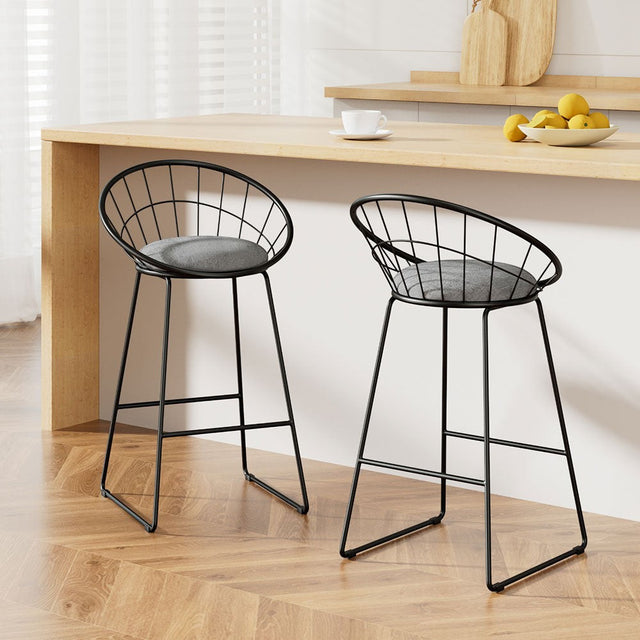 Patterson Lakes black faux linen bar stool with padded seat and steel frame at a kitchen counter