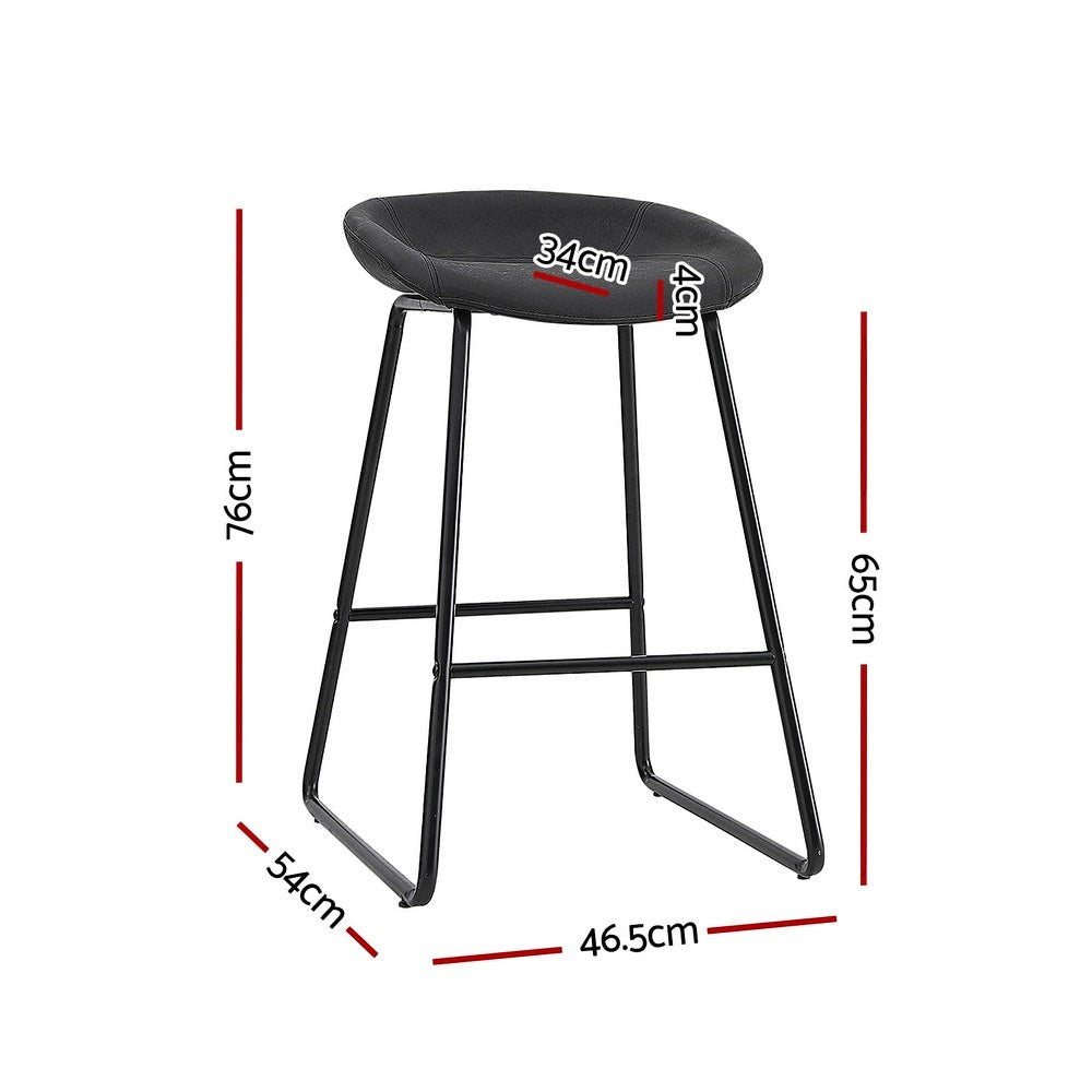 Sullivan Bay black faux leather padded metal bar stool at a kitchen counter