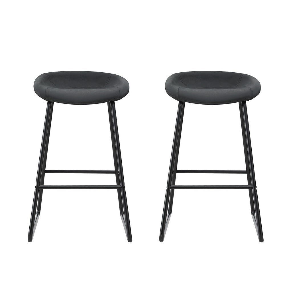 Sullivan Bay black faux leather padded metal bar stool at a kitchen counter