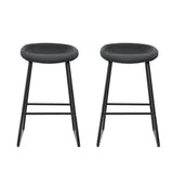 Sullivan Bay black faux leather padded metal bar stool at a kitchen counter