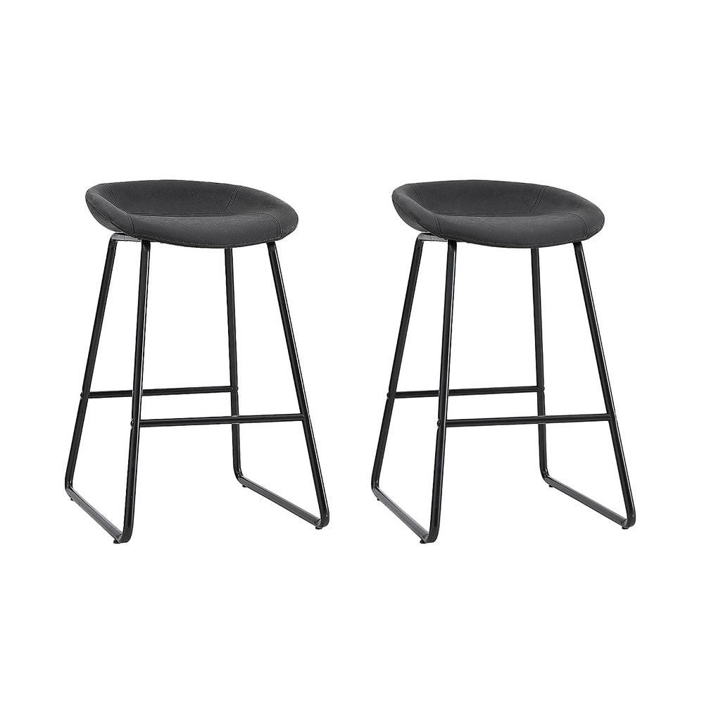 Sullivan Bay black faux leather padded metal bar stool at a kitchen counter