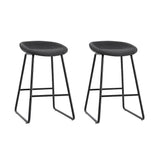Sullivan Bay black faux leather padded metal bar stool at a kitchen counter