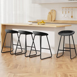 Sullivan Bay black faux leather padded metal bar stool at a kitchen counter