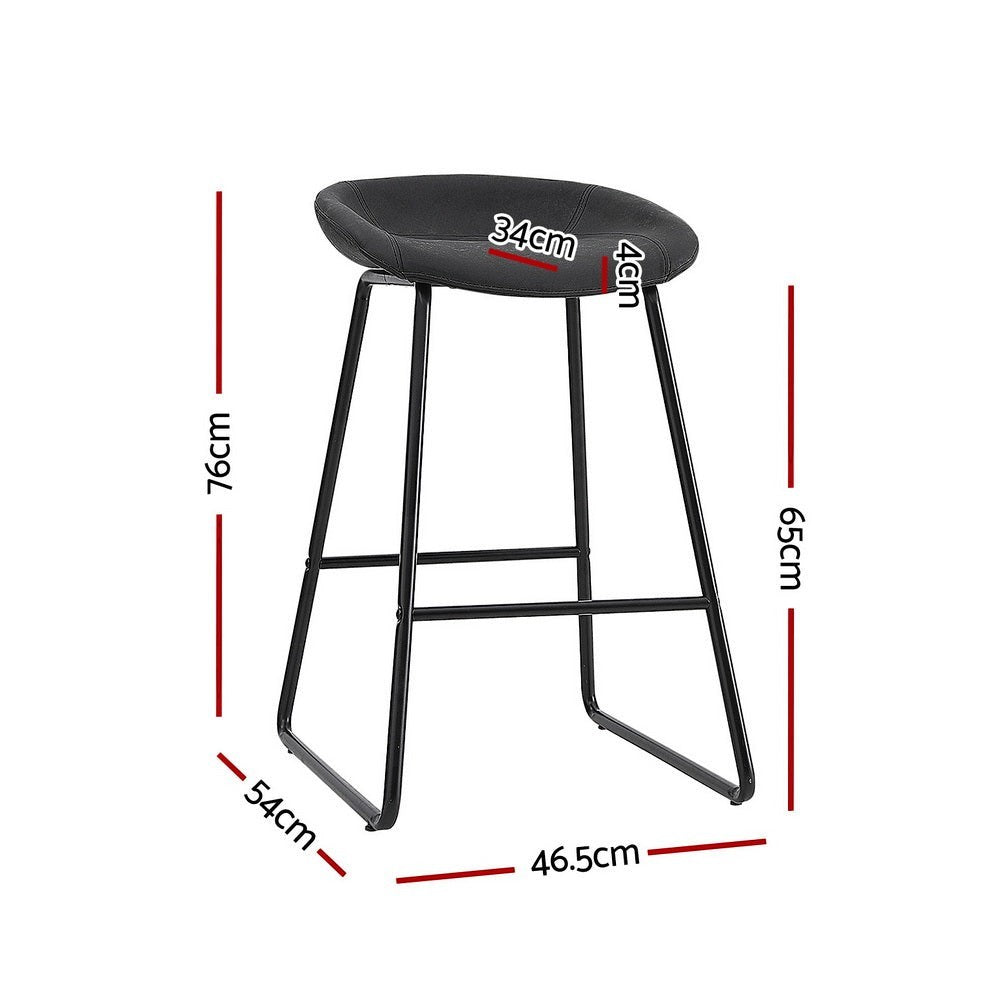 Sullivan Bay black faux leather padded metal bar stool at a kitchen counter