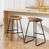 Sullivan Bay brown faux leather padded metal bar stool at a kitchen counter