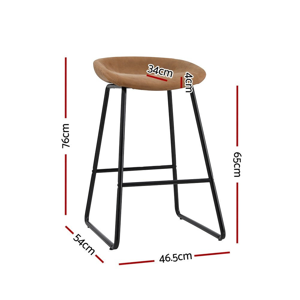 Sullivan Bay brown faux leather padded metal bar stool at a kitchen counter