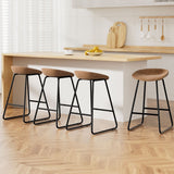 Sullivan Bay brown faux leather padded metal bar stool at a kitchen counter