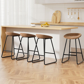 Sullivan Bay brown faux leather padded metal bar stool at a kitchen counter