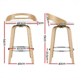 Rhyll swivel bar stool white beside a kitchen island