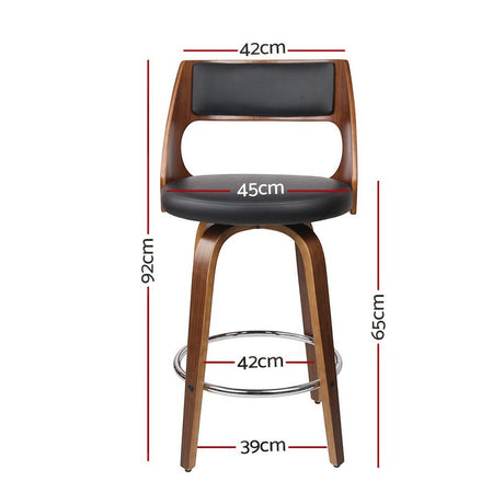 Highett black swivel faux leather bar stool with walnut legs in a modern kitchen