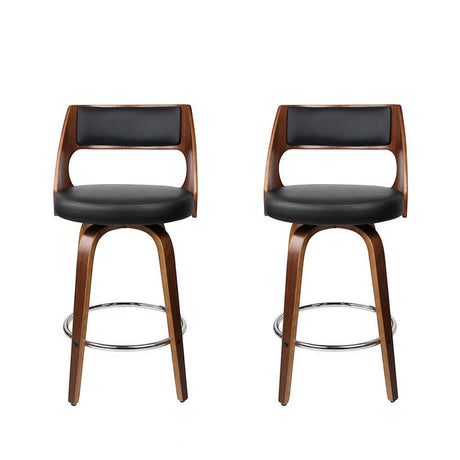 Highett black swivel faux leather bar stool with walnut legs in a modern kitchen