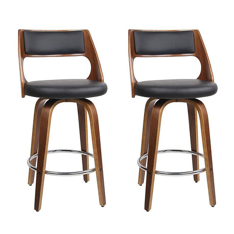 Highett black swivel faux leather bar stool with walnut legs in a modern kitchen