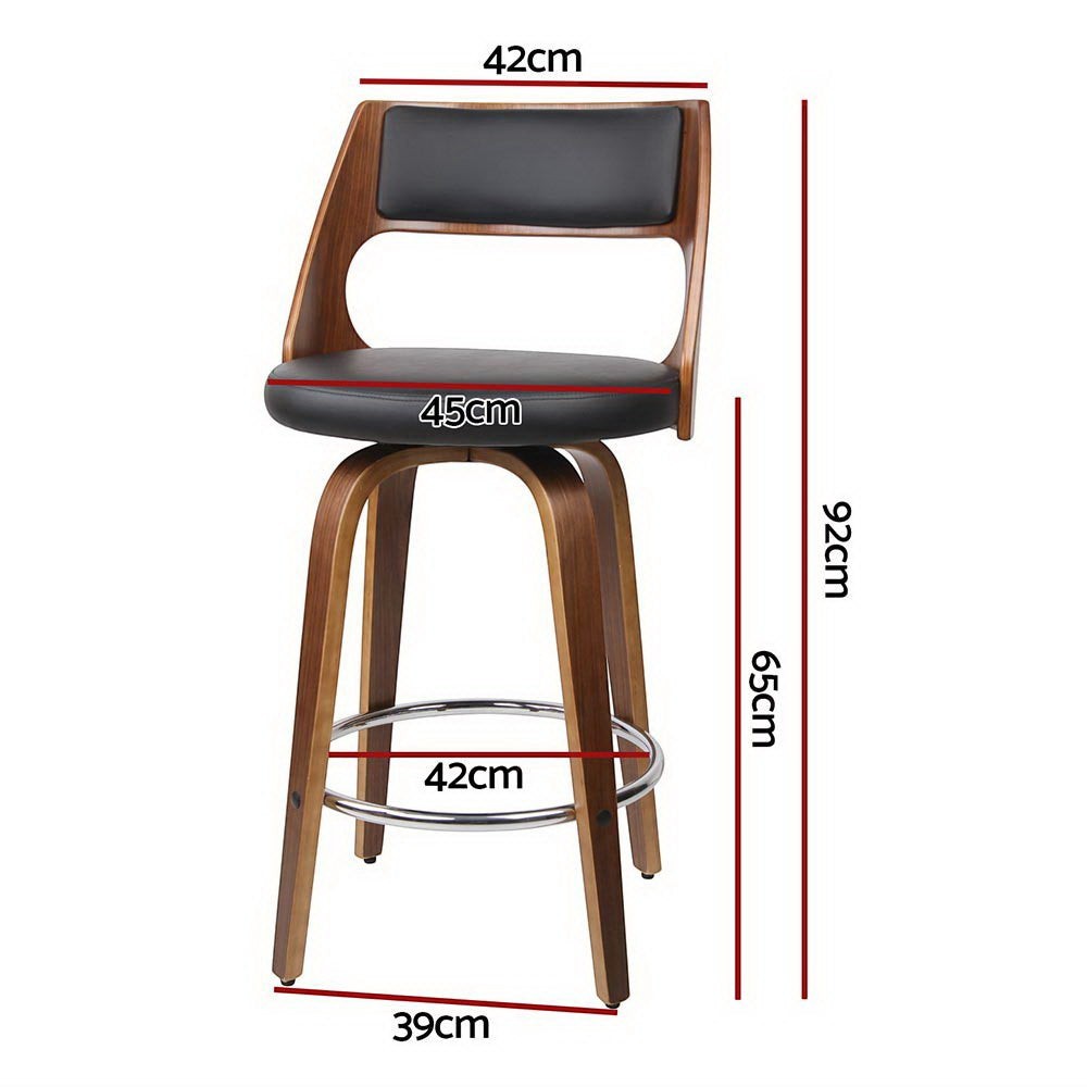 Highett black swivel faux leather bar stool with walnut legs in a modern kitchen
