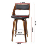Highett black swivel faux leather bar stool with walnut legs in a modern kitchen
