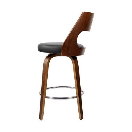Highett black swivel faux leather bar stool with walnut legs in a modern kitchen