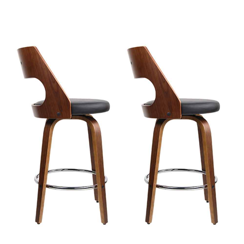 Highett black swivel faux leather bar stool with walnut legs in a modern kitchen