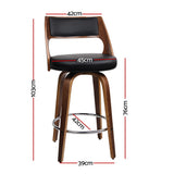 Highett black swivel faux leather bar stool with walnut legs in a modern kitchen