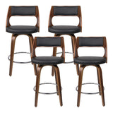Highett black swivel faux leather bar stool with walnut legs in a modern kitchen