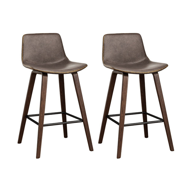 Devilbend walnut wooden bar stool with faux leather seat in a warm kitchen