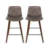 Devilbend walnut wooden bar stool with faux leather seat in a warm kitchen