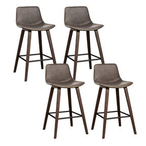Devilbend walnut wooden bar stool with faux leather seat in a warm kitchen