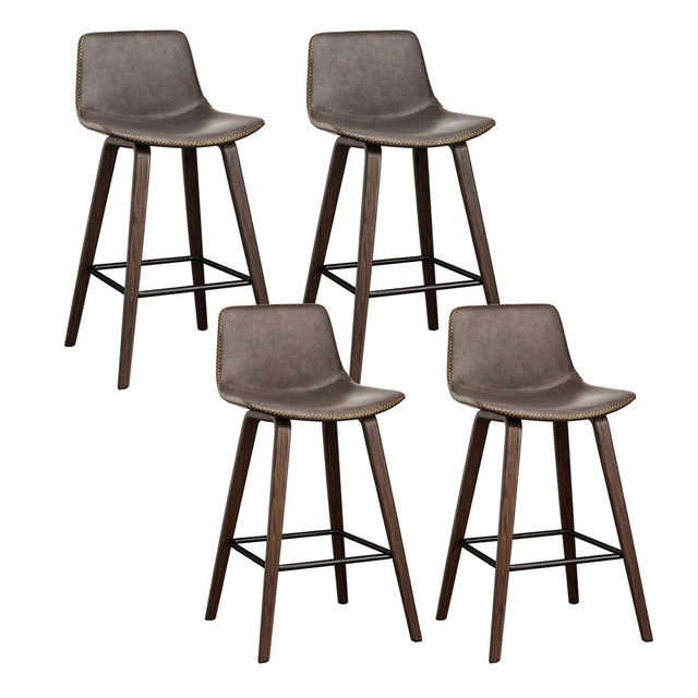 Devilbend walnut wooden bar stool with faux leather seat in a warm kitchen