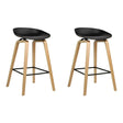 London Bridge black wooden bar stool with moulded seat at a kitchen counter