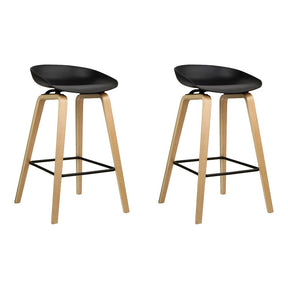 London Bridge black wooden bar stool with moulded seat at a kitchen counter