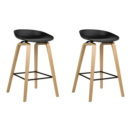 London Bridge black wooden bar stool with moulded seat at a kitchen counter