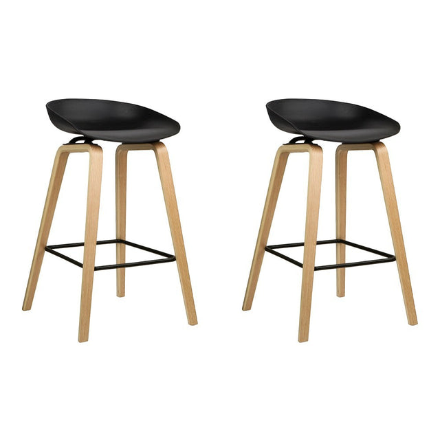 London Bridge black wooden bar stool with moulded seat at a kitchen counter