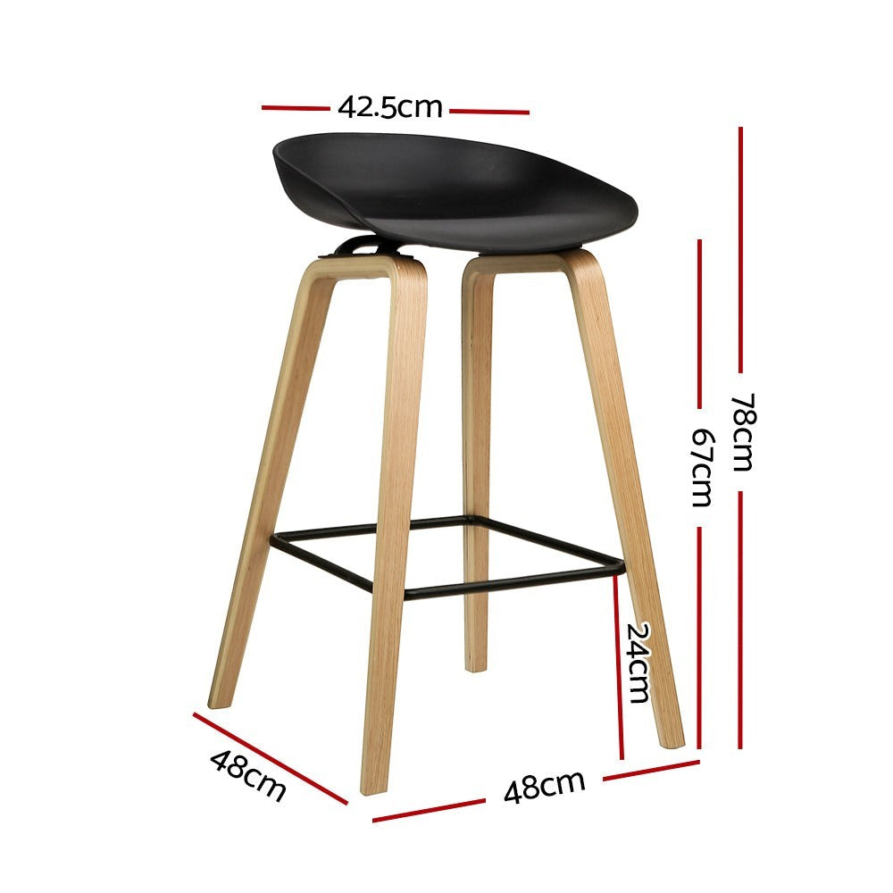London Bridge black wooden bar stool with moulded seat at a kitchen counter