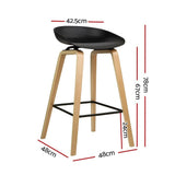 London Bridge black wooden bar stool with moulded seat at a kitchen counter