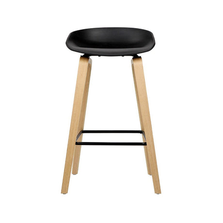 London Bridge black wooden bar stool with moulded seat at a kitchen counter