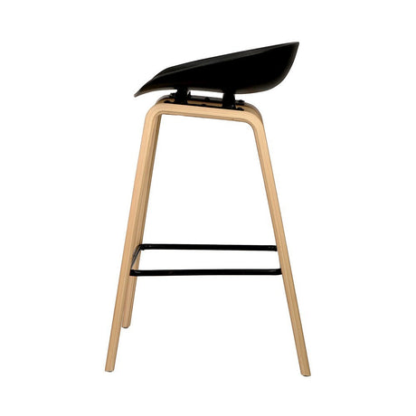 London Bridge black wooden bar stool with moulded seat at a kitchen counter