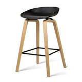 London Bridge black wooden bar stool with moulded seat at a kitchen counter