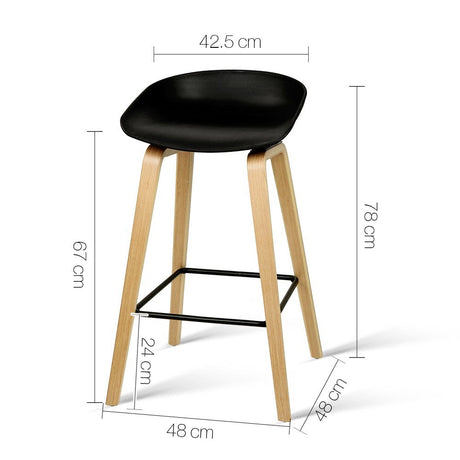 London Bridge black wooden bar stool with moulded seat at a kitchen counter