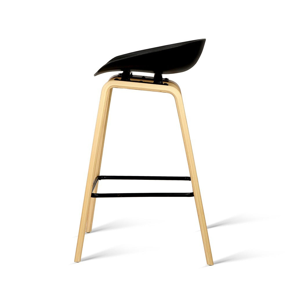 London Bridge black wooden bar stool with moulded seat at a kitchen counter