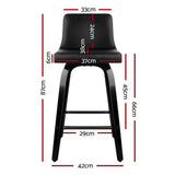 Balcombe black swivel wooden bar stool with padded seat in a modern kitchen