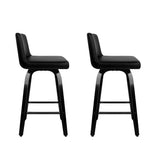 Balcombe black swivel wooden bar stool with padded seat in a modern kitchen