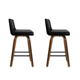 Balcombe walnut swivel wooden bar stool with padded seat in a modern kitchen