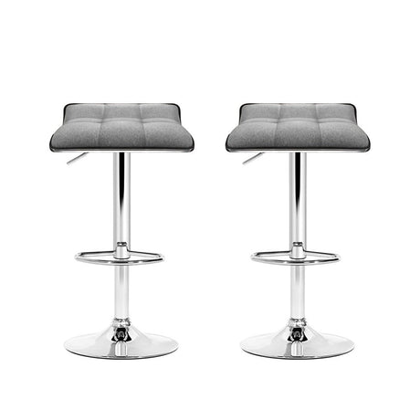 Coronet Bay grey faux linen gas lift swivel bar stool in a modern kitchen